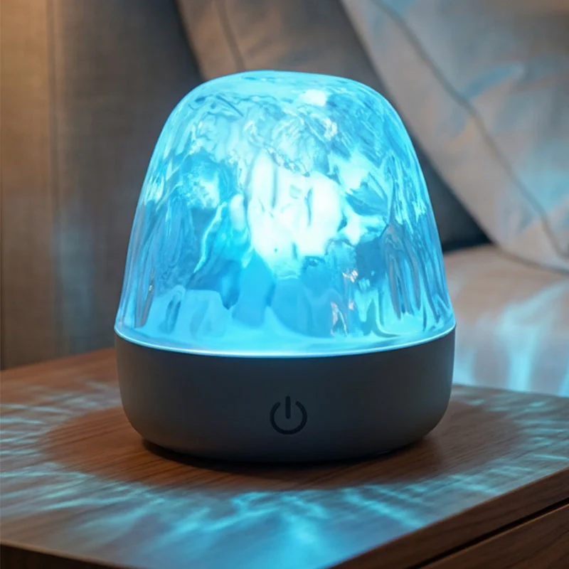 Lampada a LED a 16 colori con effetto increspatura dell'acqua e telecomando.